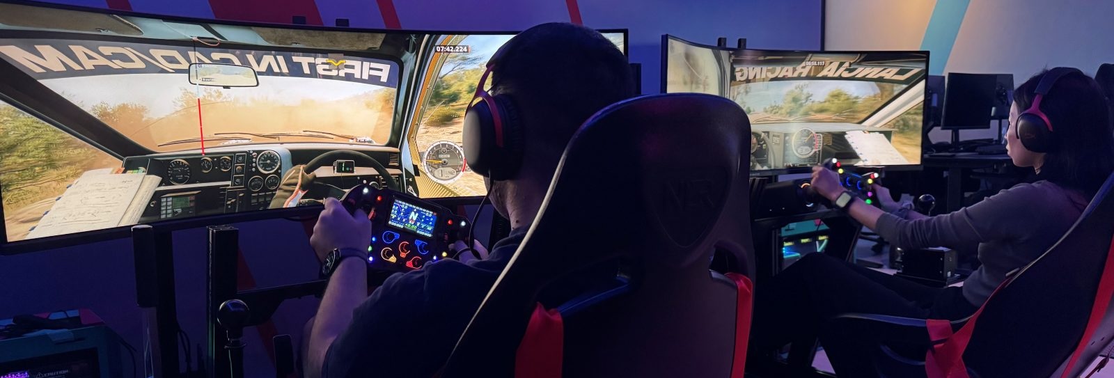 Driver at a direct drive sim racing rig, rally game across a triple curved screen, at Level3 Hub Pattaya