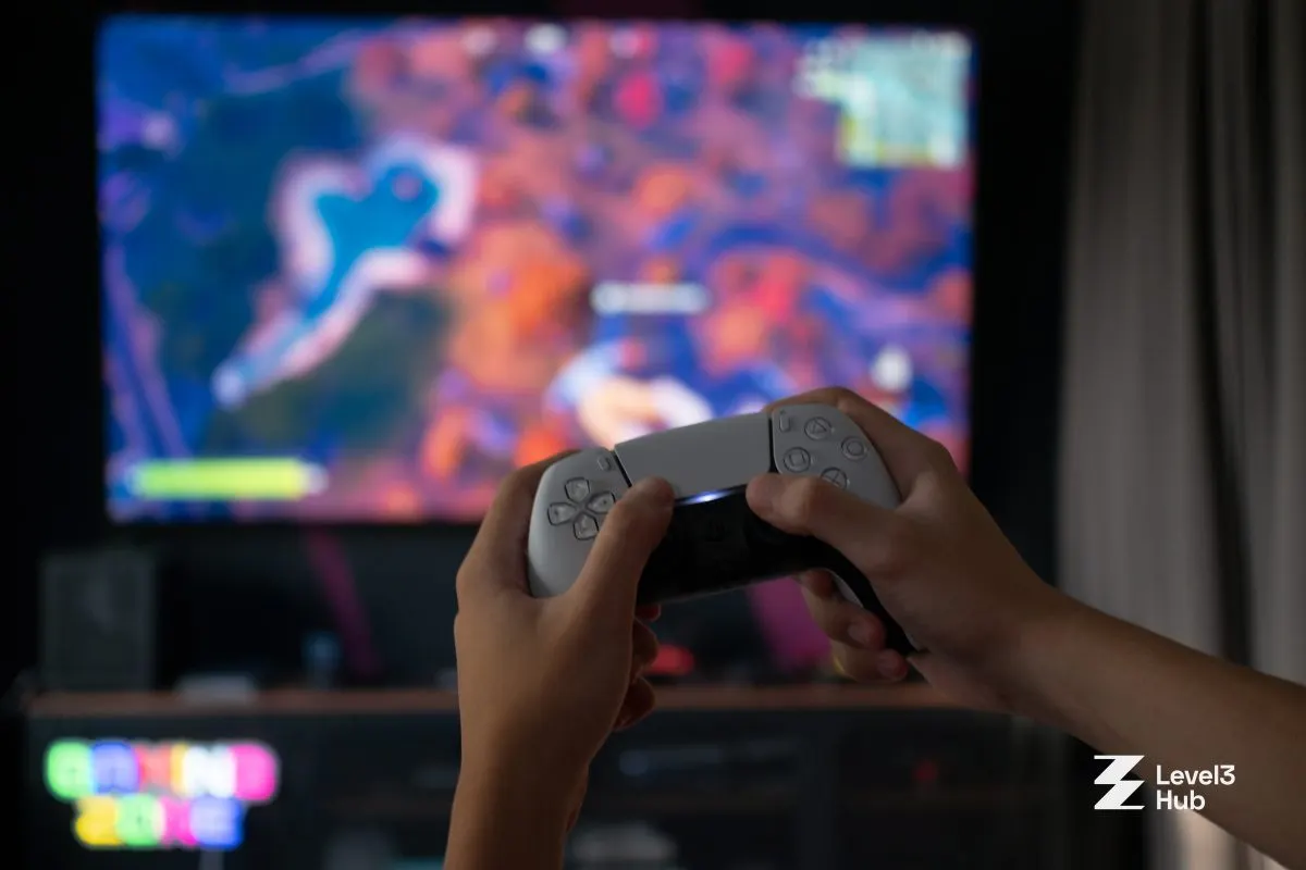 A guest playing PlayStation 5 on the big screen in a Level3 console room