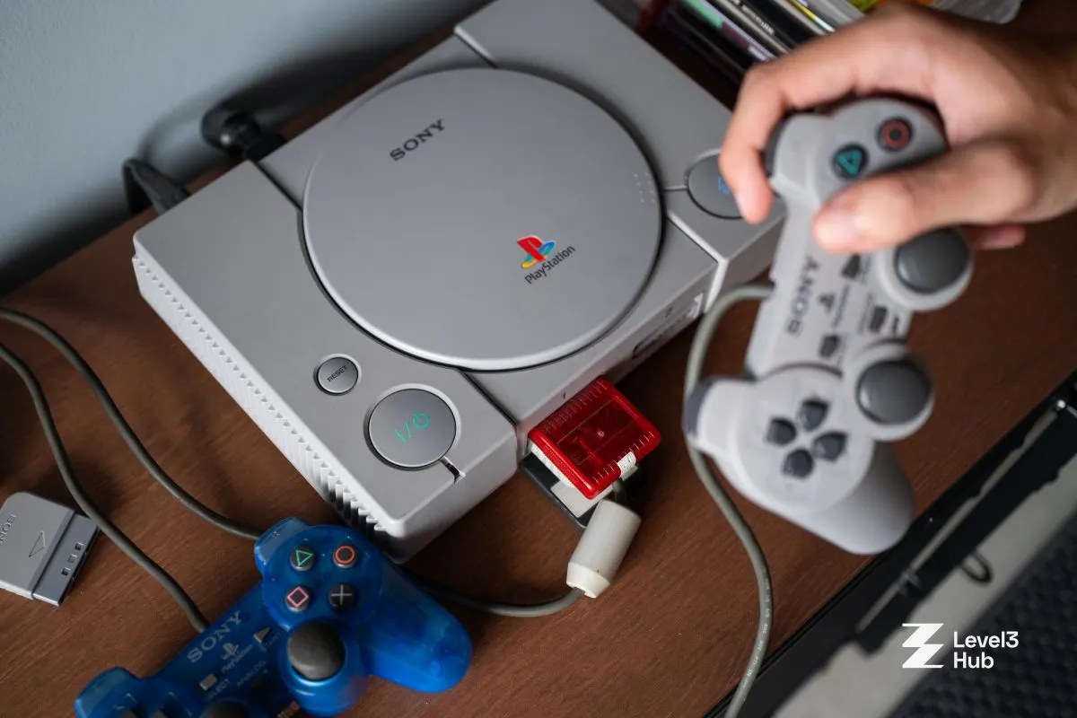 An original PlayStation with its grey controllers at Level3 Hub