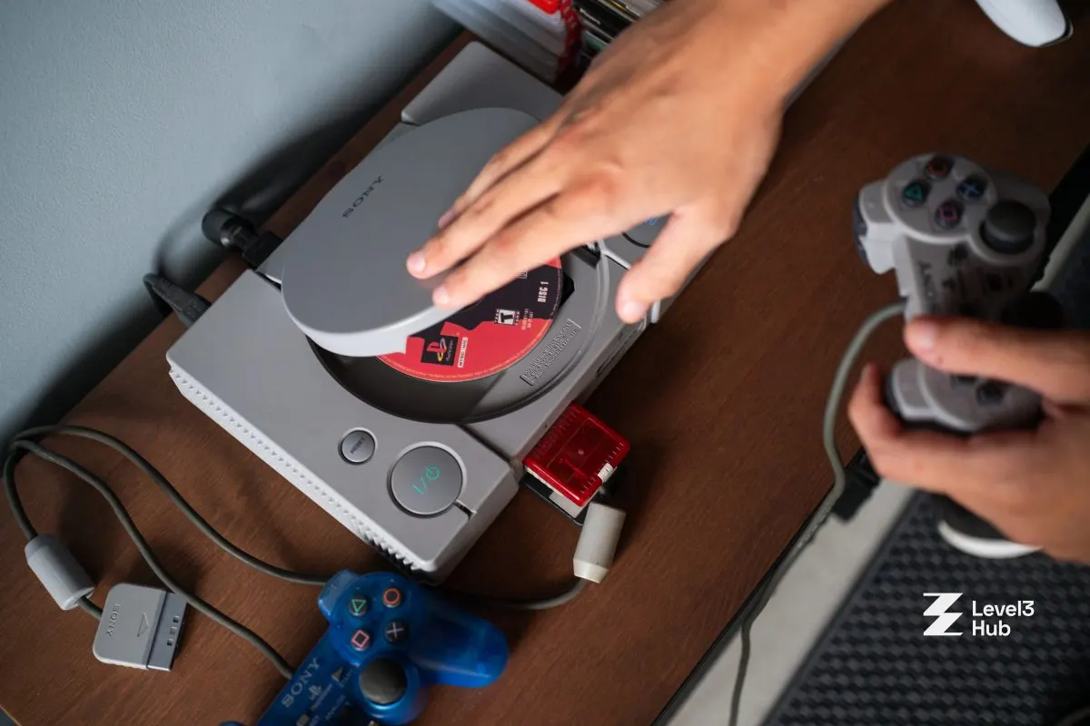A PlayStation 1 disc going into the console