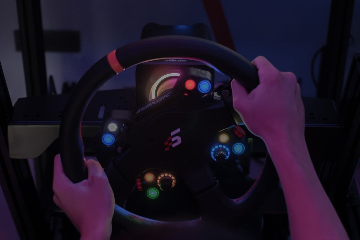 Hands on a lit Simagic racing wheel